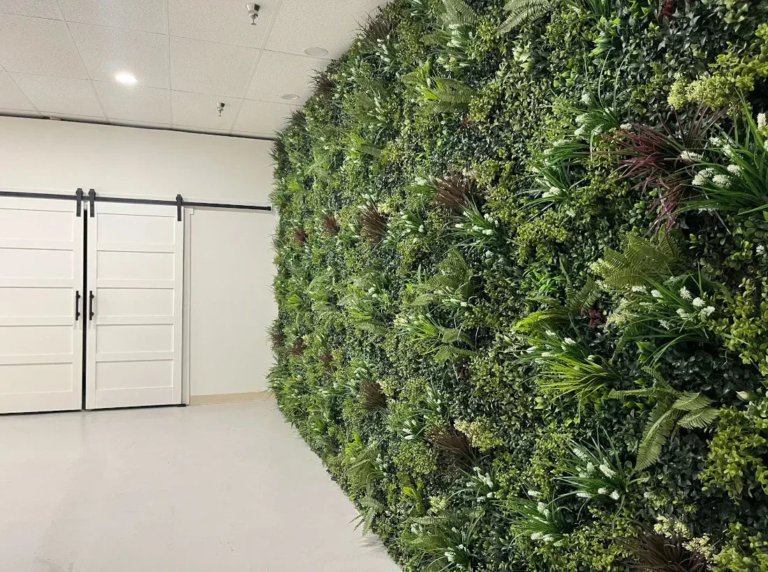 artificial green wall in all white room