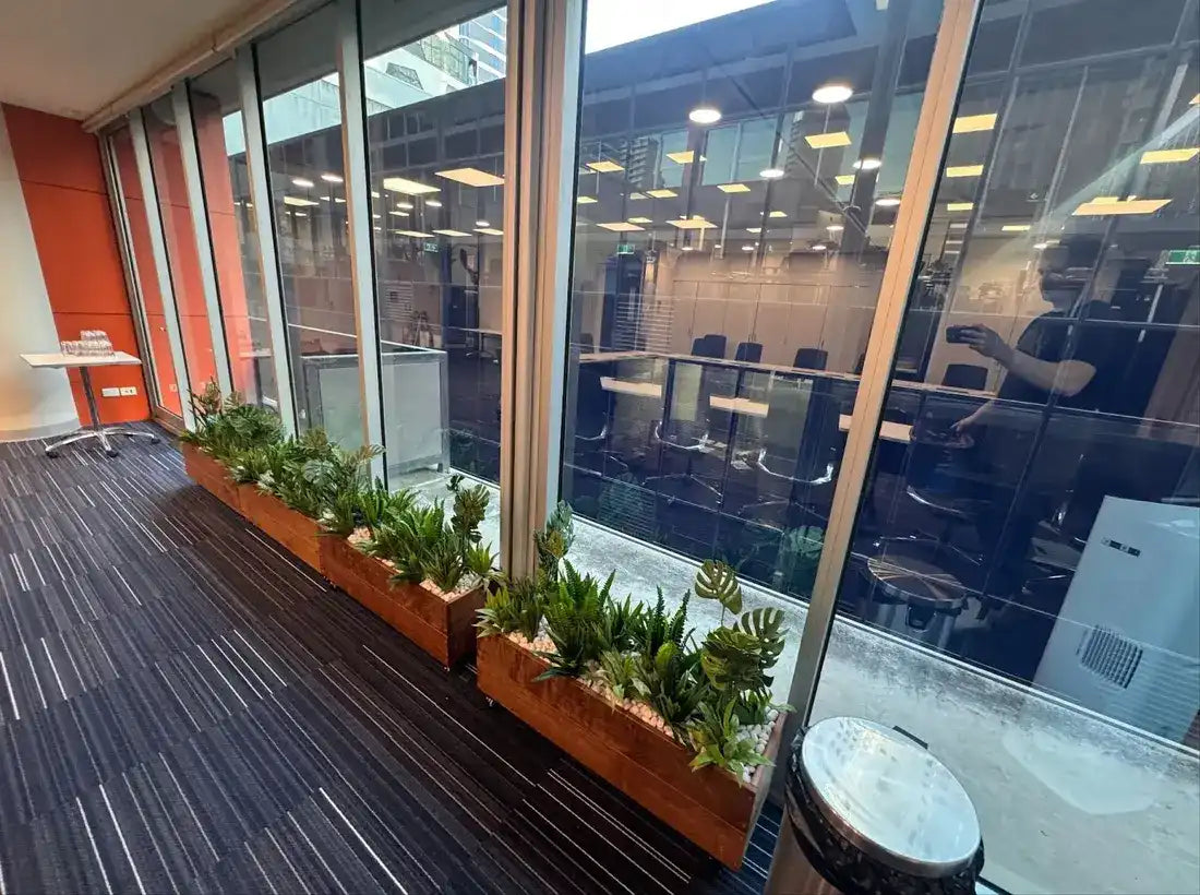 Artificial monstera split leaf philodendron plant at client office second angle