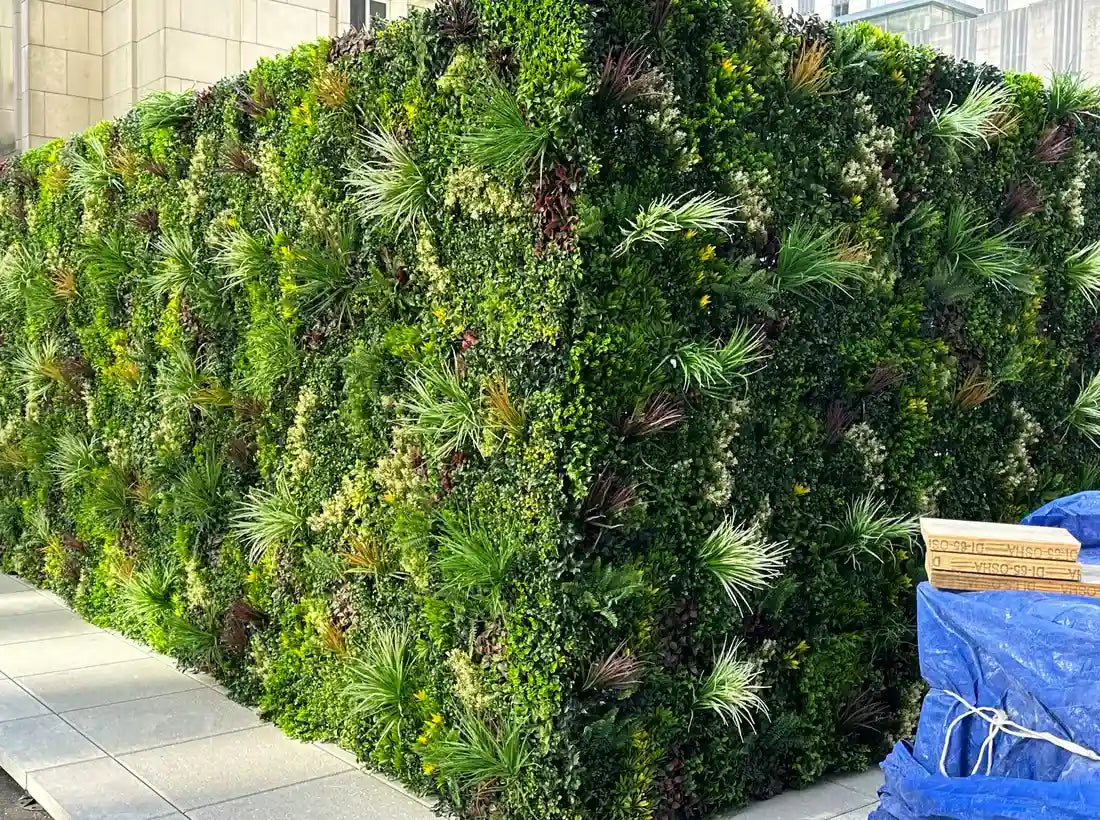Corner view artificial vertical garden lush fake plants commercial installation Designer Plants