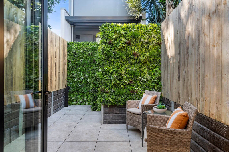 Premium Artificial Vertical Garden Panel Vista Green Installed along a back fence for privacy