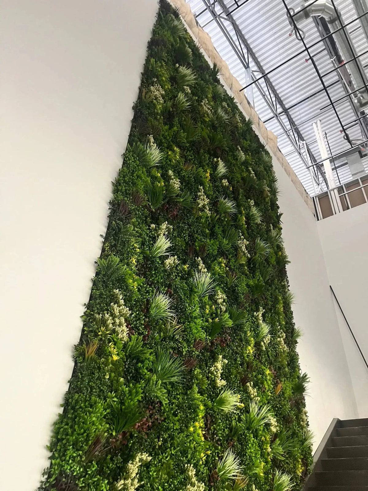 Commercial-grade Evergreen Triptych Artificial Vertical Garden Green Wall Panel Set of 3 with dense, lifelike evergreen foliage and natural-looking mixed greenery. UV resistant artificial green wall system covering 33 sq ft, perfect for residential gardens, cafés, restaurants, offices, shopping centres, event spaces, and indoor or outdoor feature walls.