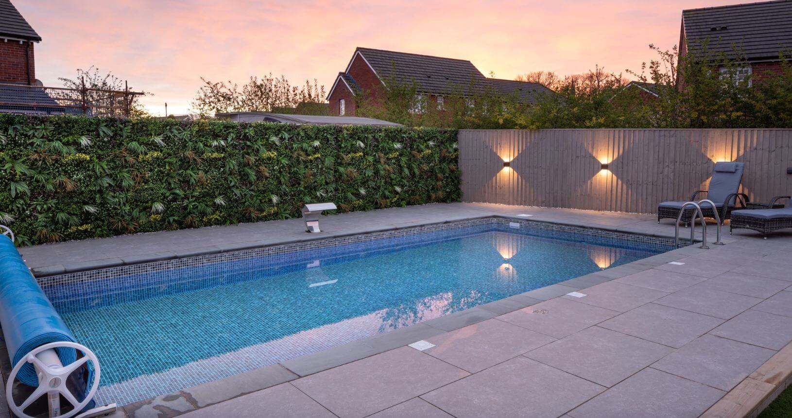 Swimming Pool with wild tropics living wall panel and yellow flowers added in