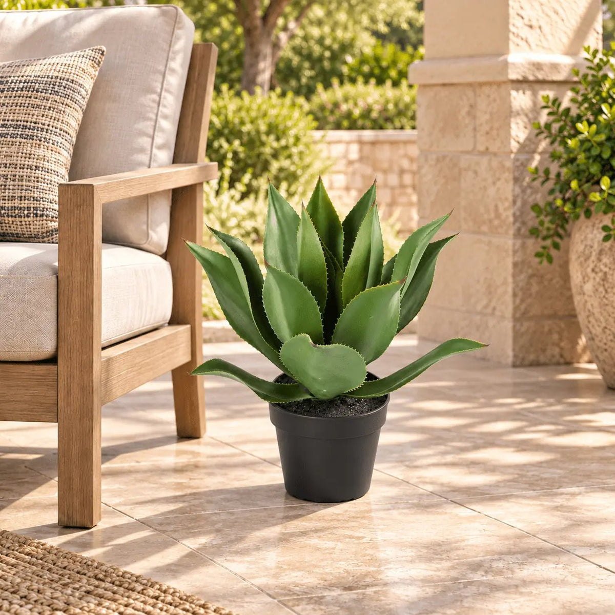 21.7-inch UV-resistant artificial Agave tree in its black nursery pot on a covered outdoor patio
