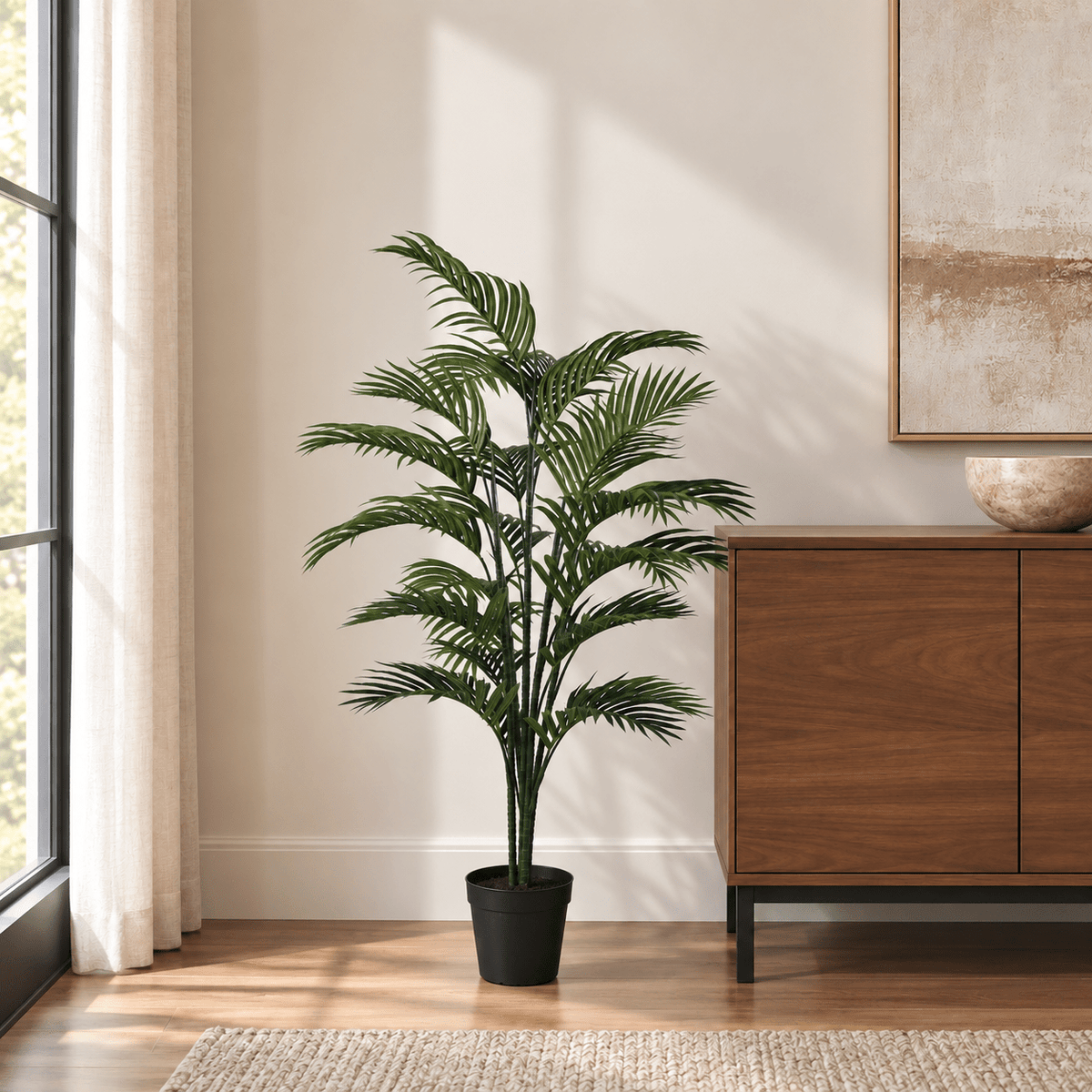 47.2-inch Areca Palm artificial tree in its black nursery pot beside an indoor credenza