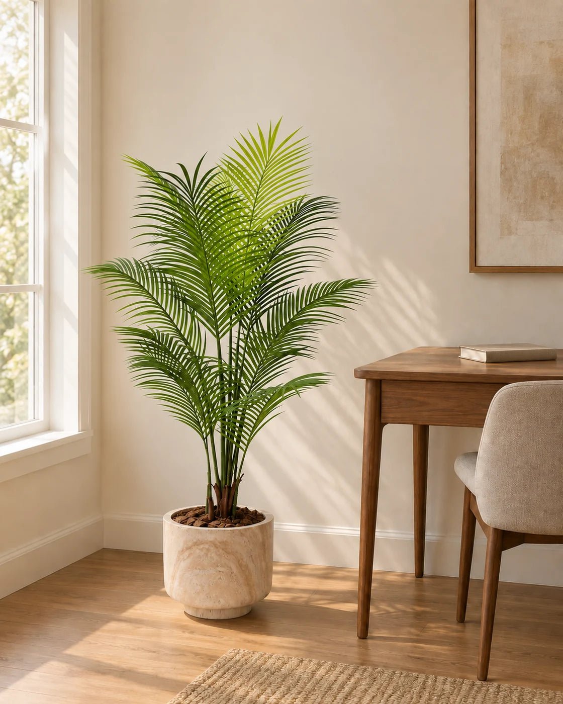120 cm artificial Areca Palm in a marble-effect pedestal planter beside a walnut desk in a sunlit home office.