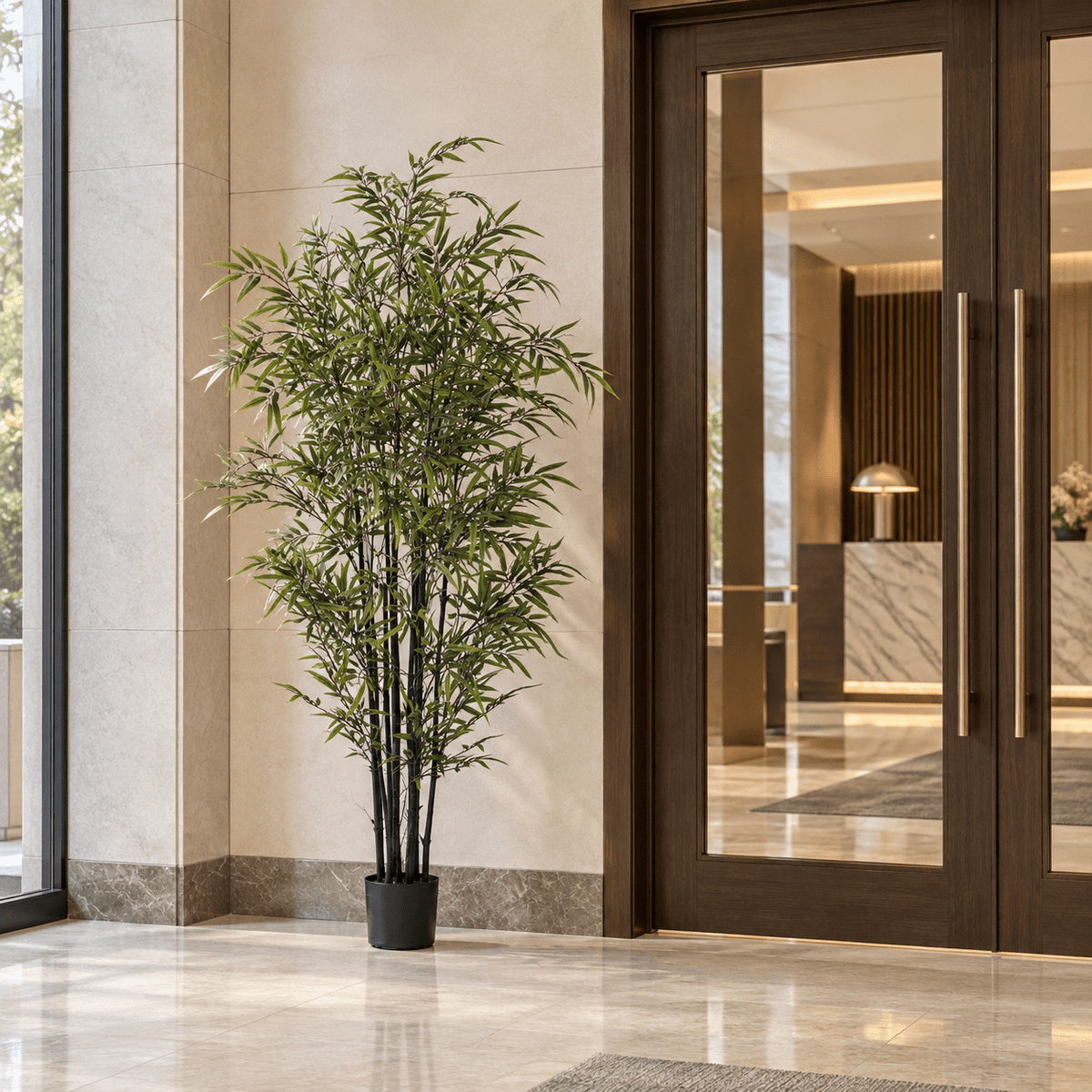 70.9-inch Black Bamboo artificial tree with dark culms in its black nursery pot in an indoor hotel lobby