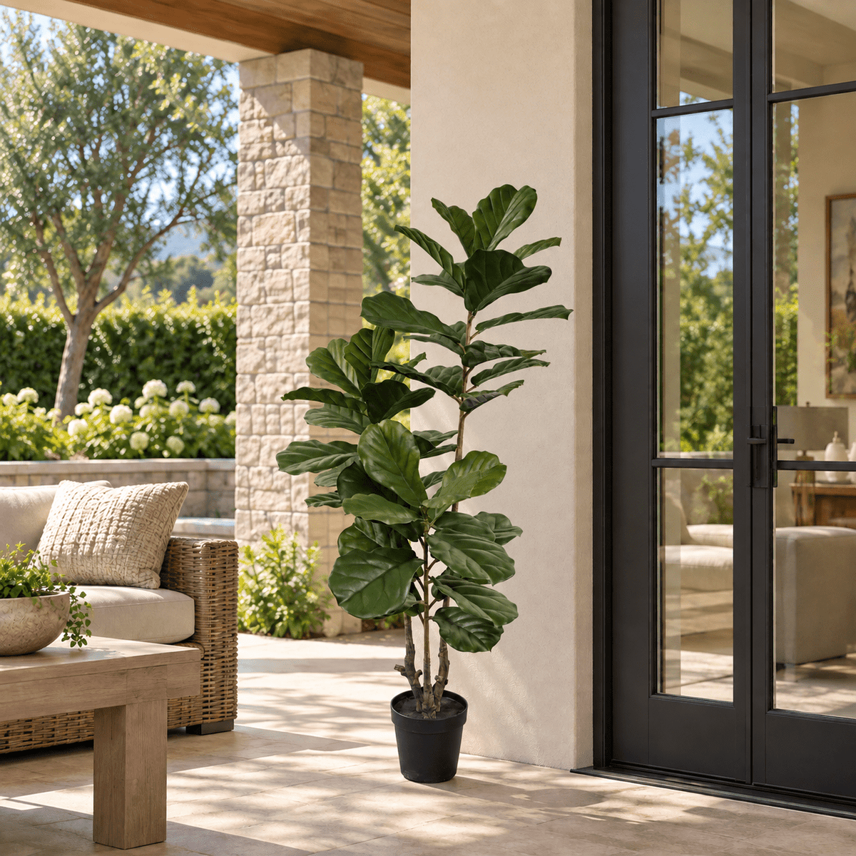63-inch UV-resistant Fiddle Leaf artificial tree in its black nursery pot on a covered outdoor patio