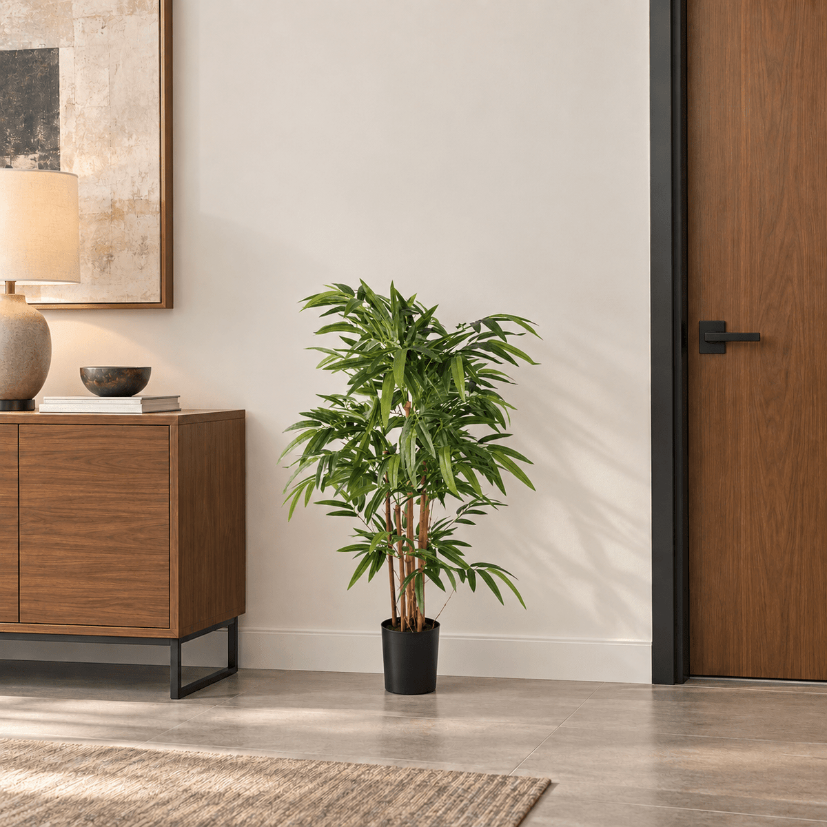 47.2-inch natural trunk Bamboo artificial tree in its black nursery pot in an indoor office lounge