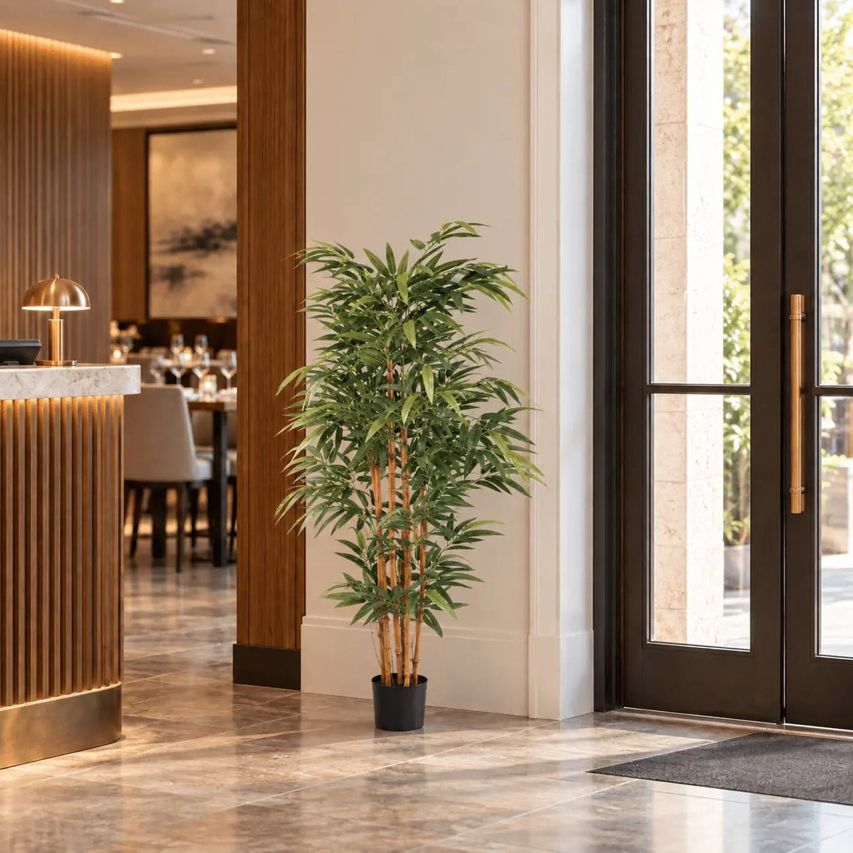59.1-inch natural trunk Bamboo artificial tree in its black nursery pot in an indoor reception area
