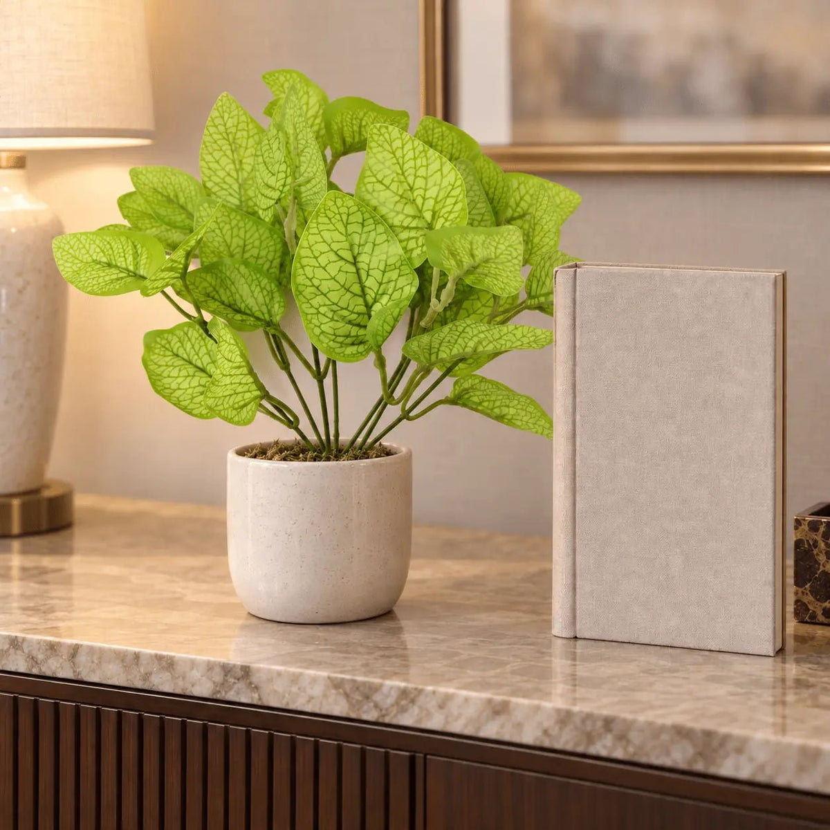 11-inch Philodendron Golden Leaf artificial bush in a ceramic pot on an indoor console