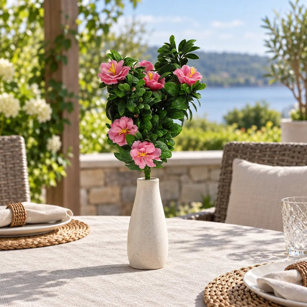 18-inch UV-resistant pink rose artificial bunch displayed in a vase on a covered patio table