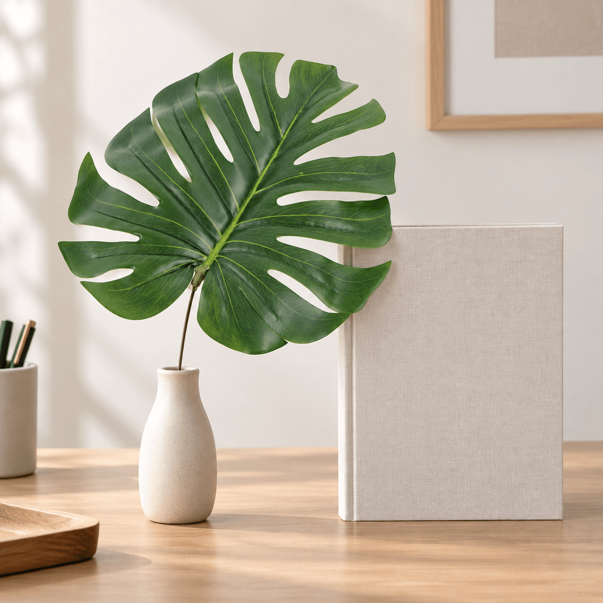 11.5-inch single split Philodendron artificial leaf in a bud vase on an indoor desk