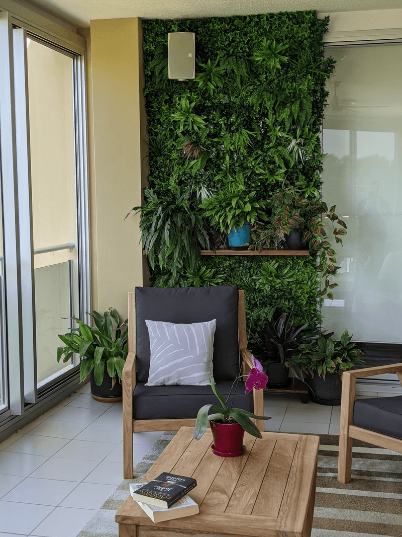 Wall feature with artificial vertical garden panels