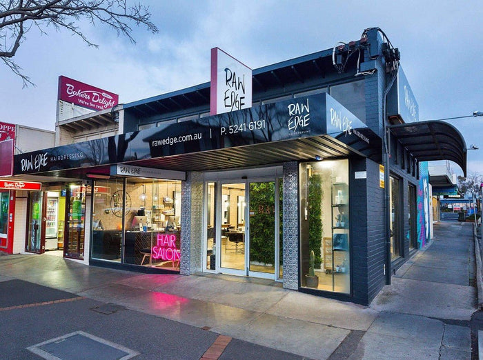 A Salon Client Benefits from Artificial Green Walls by Designer Plants