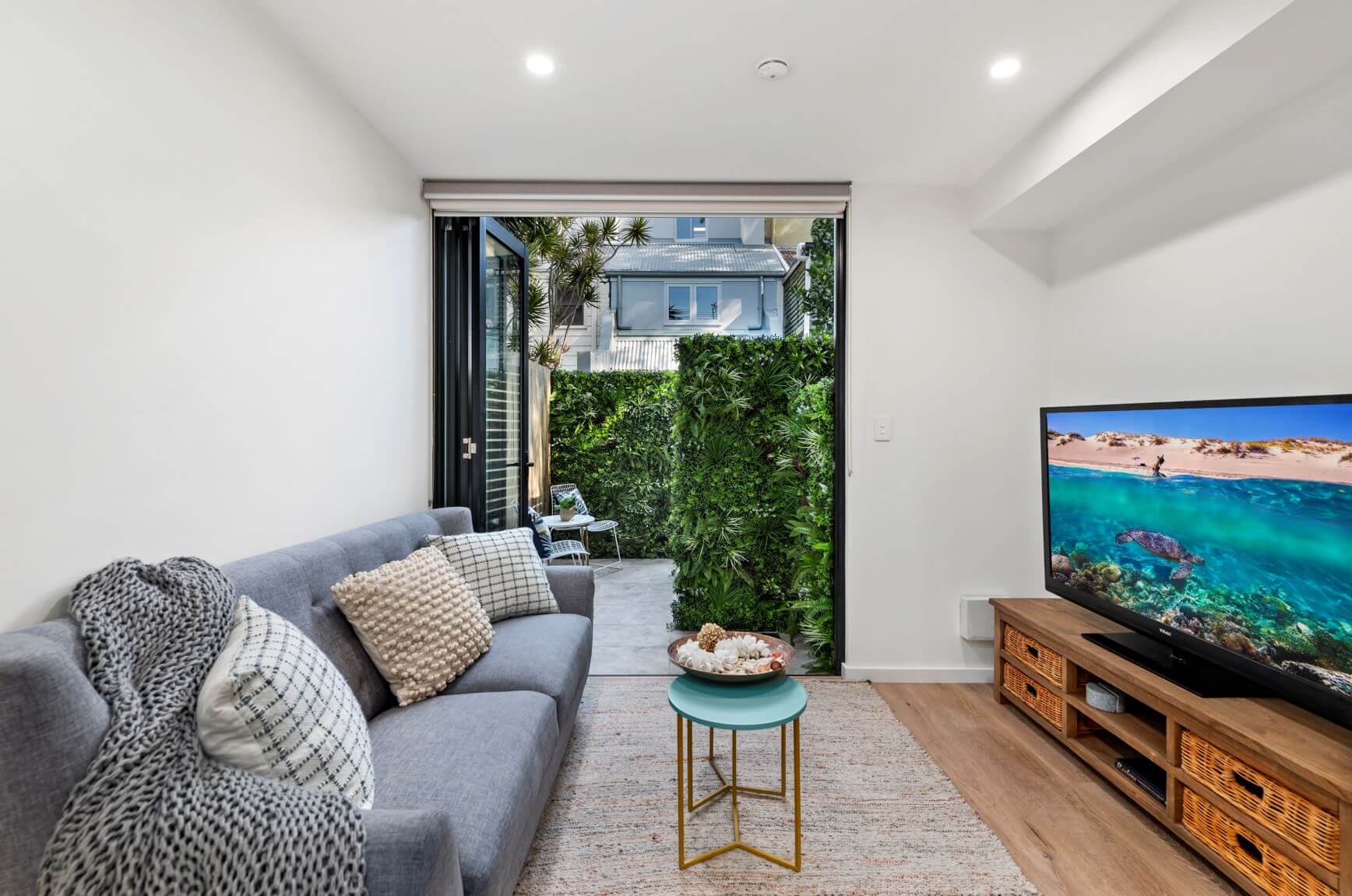 Premium Artificial Vertical Garden Panel Vista Green Along a Timber Back Fence View from Kitchen