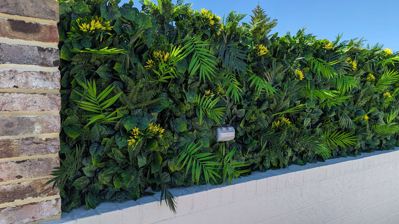 Faux Flowering Artificial Green Wall Panels on a roof top garden