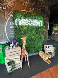 Artificial Living Wall with Corporate Signage on a Moving Stand Mounted to a Wall