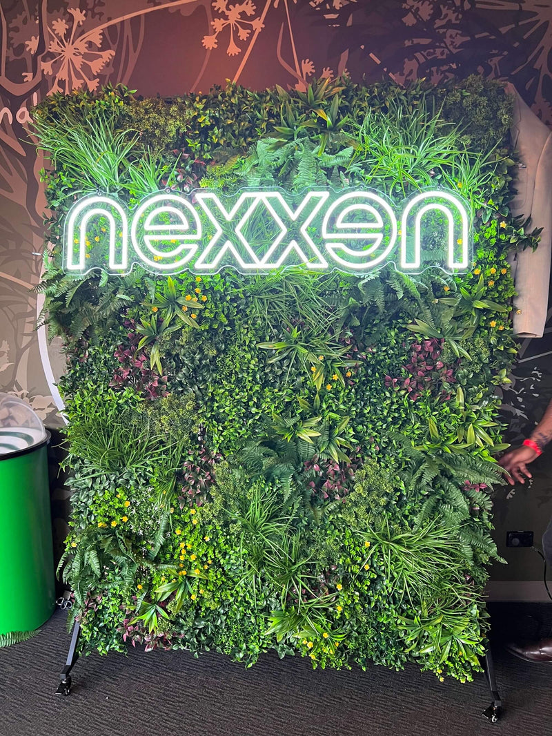 Artificial Living Wall with Corporate Signage on a Moving Stand