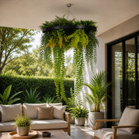 UV resistant artificial hanging green wall disc with draping vines and fern foliage styled in a contemporary outdoor patio seating area.