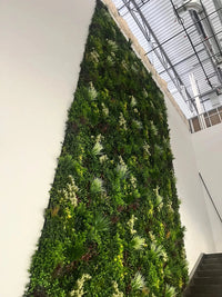 Commercial-grade Evergreen Triptych Artificial Vertical Garden Green Wall Panel Set of 3 with dense, lifelike evergreen foliage and natural-looking mixed greenery. UV resistant artificial green wall system covering 33 sq ft, perfect for residential gardens, cafés, restaurants, offices, shopping centres, event spaces, and indoor or outdoor feature walls.