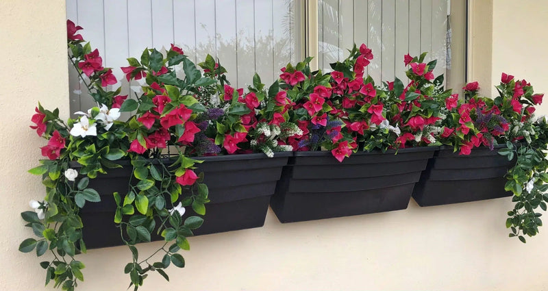 A black window box adorned with (5 Pieces) Vibrant Pink Hanging Artificial Bougainvillea Plant, UV Resistant 35" faux flowers.