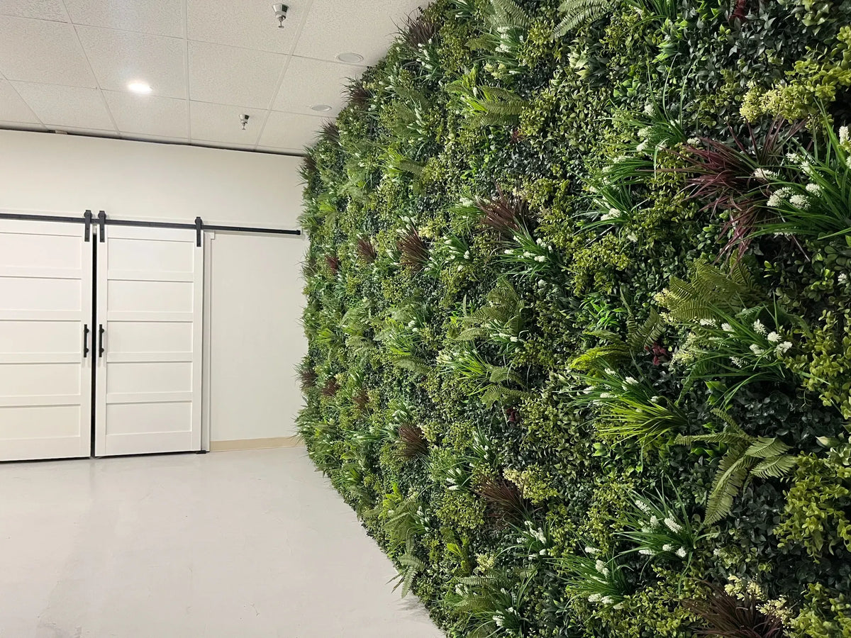 Premium Luxury Lush Spring vertical garden wall installation showcasing realistic mixed foliage and dense greenery designed for modern indoor spaces and feature walls.