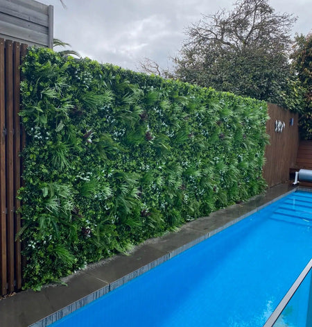 Premium Artificial Vertical Garden Panel Vista Green Installed Along a Pool onto a Fence