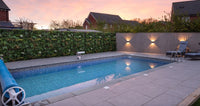 Pool install with plastic plant wall panels on the fence