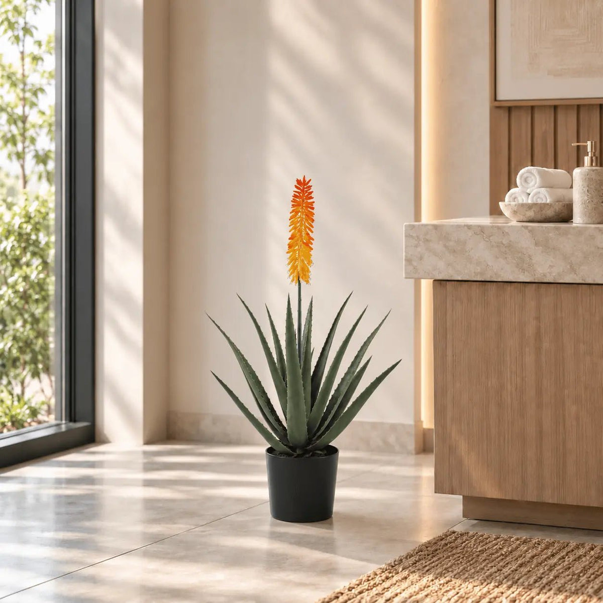 33.5-inch artificial Aloe Vera tree with orange flower displayed in an indoor spa setting