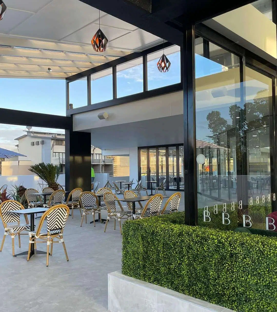 Light Artificial Boxwood Hedge Freestanding Event Hedge at a Diner