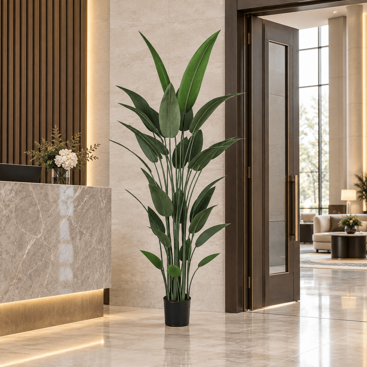 82.7-inch Bird of Paradise artificial tree in its black nursery pot in an indoor hotel lobby