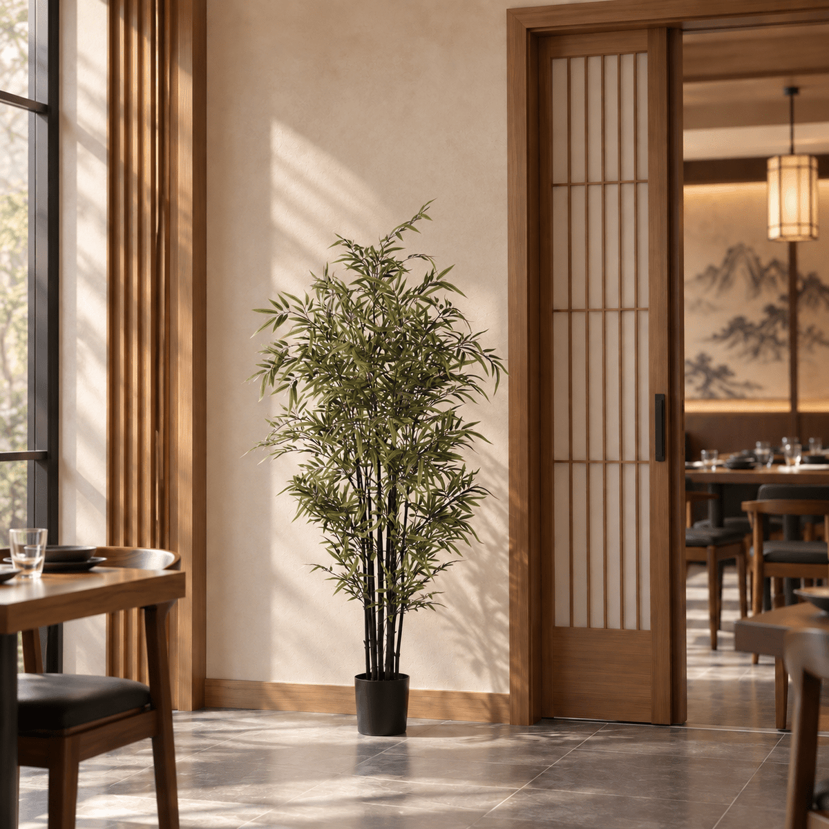 59.1-inch Black Bamboo artificial tree with dark culms in its black nursery pot in an indoor restaurant