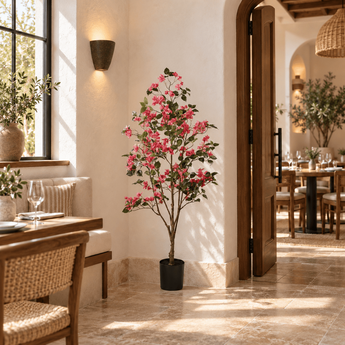 59.1-inch Bougainvillea artificial tree with pink flowers in its black nursery pot in a restaurant interior
