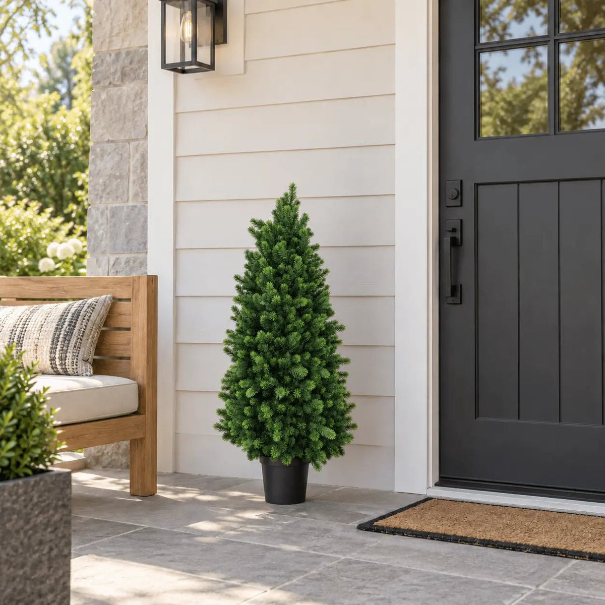 47.2-inch UV-resistant artificial cypress pine tree in its black nursery pot beside an exterior door
