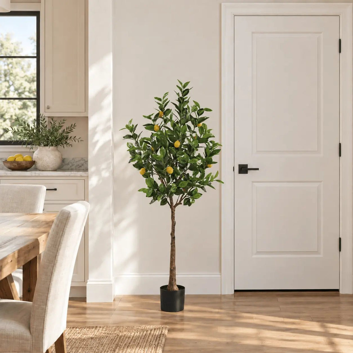 63-inch Lemon artificial tree with yellow fruit in its black nursery pot in an indoor dining area
