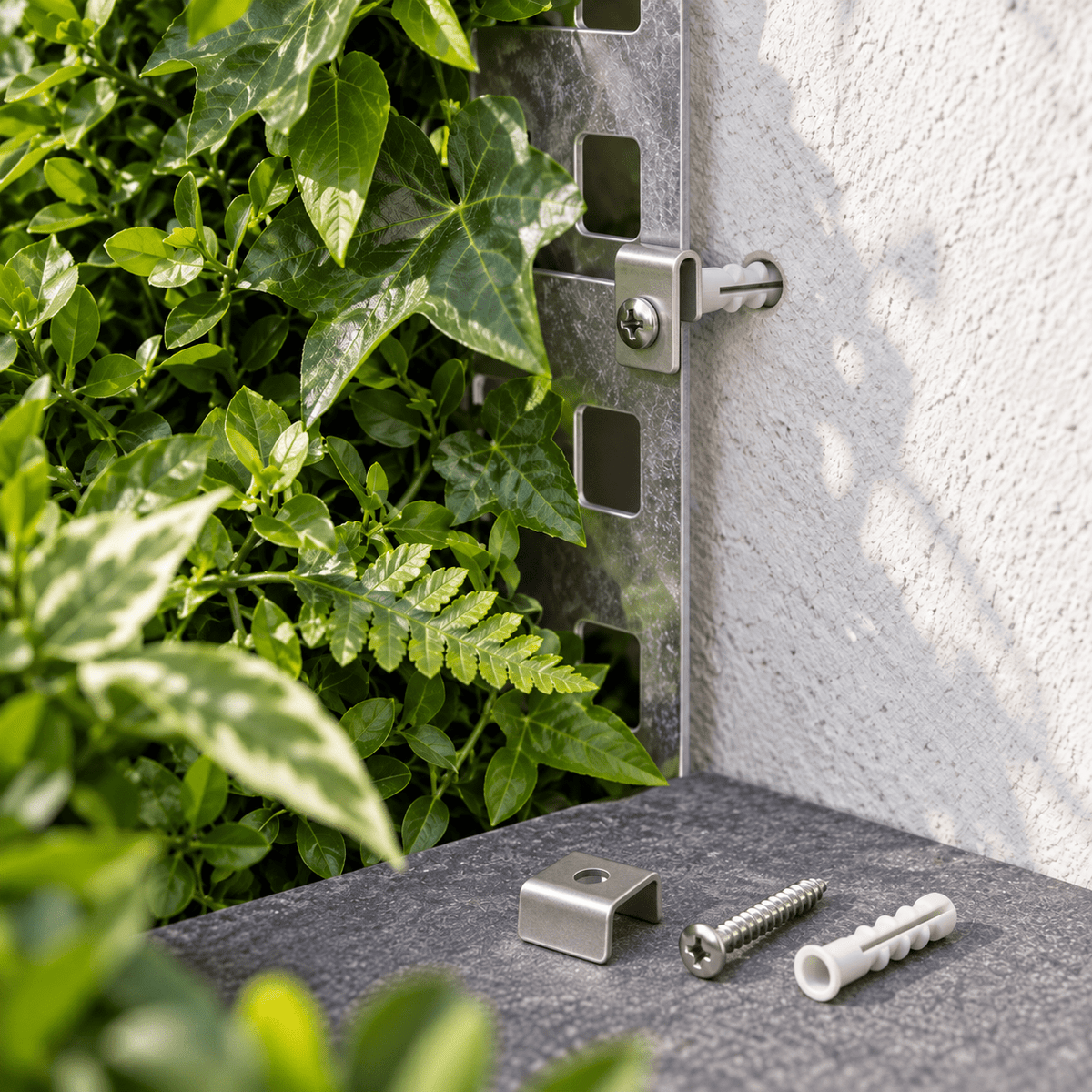 U-shaped metal clip, screw and wall plug securing a metal-backed artificial green wall panel