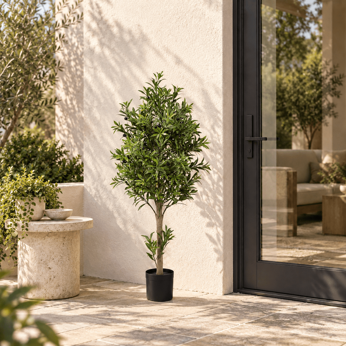 47.2-inch UV-resistant artificial olive tree in its black nursery pot in a sheltered courtyard