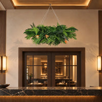 40-inch tropical artificial plant arrangement suspended over an indoor restaurant reception counter