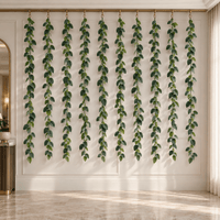 Set of ten 74.8-inch veined artificial ivy garlands installed on an indoor feature wall