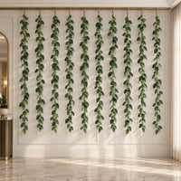 Set of ten 74.8-inch veined artificial ivy garlands installed on an indoor feature wall