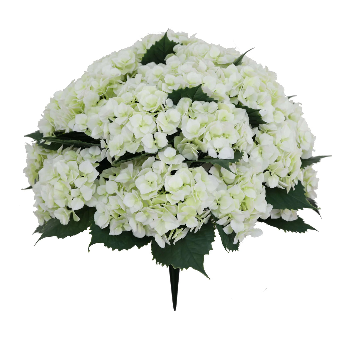 White artificial hydrangea bush with green leaves and an integrated planting stake on a white background