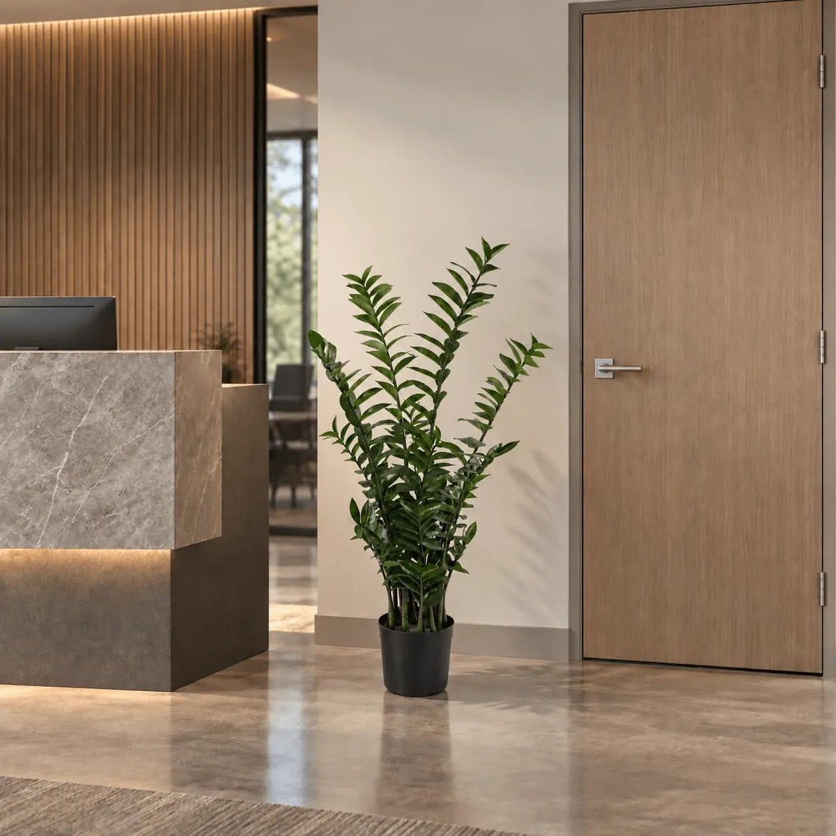 51.2-inch Zanzibar Gem artificial tree in its black nursery pot in an indoor reception area