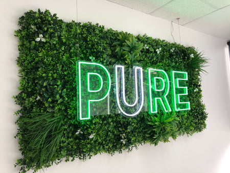Artificial Green Wall Panel Used for Signage in a Shop
