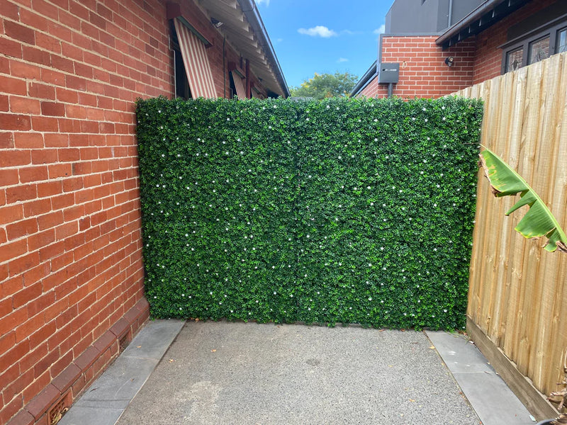 Privacy fence using faux artificial boxwood hedge panels