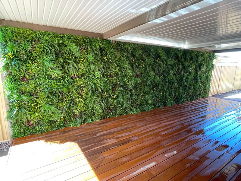 Premium artificial vertical garden panel along a deck